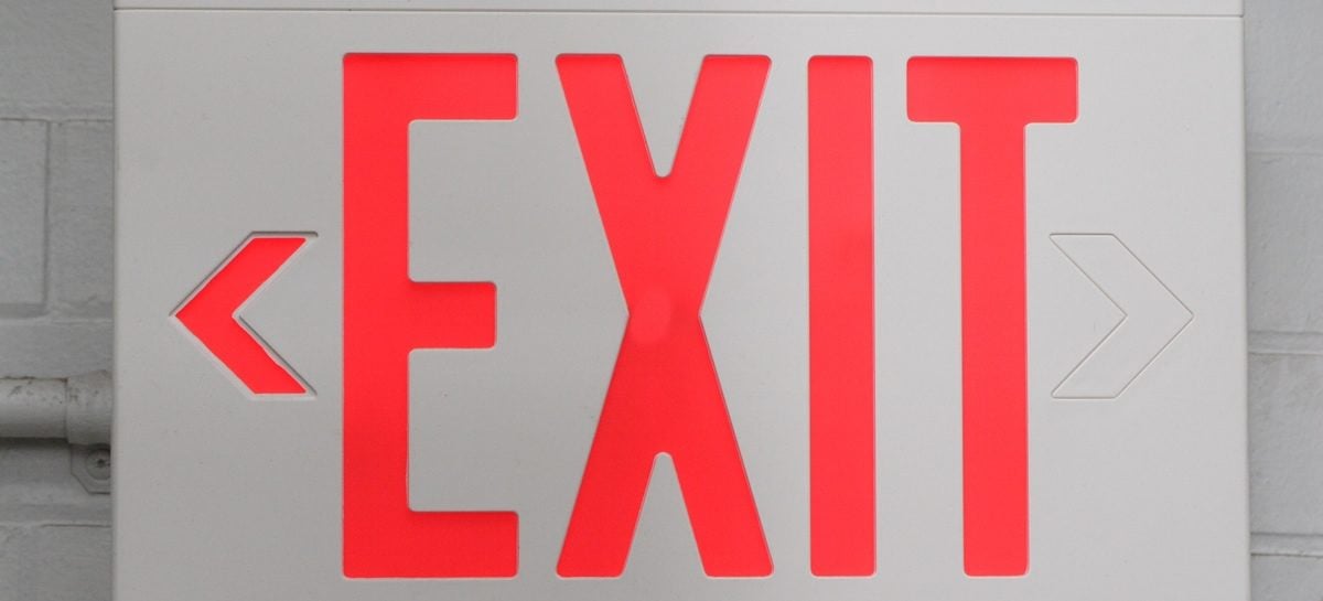 Code Question: What are exit sign requirements for office spaces?