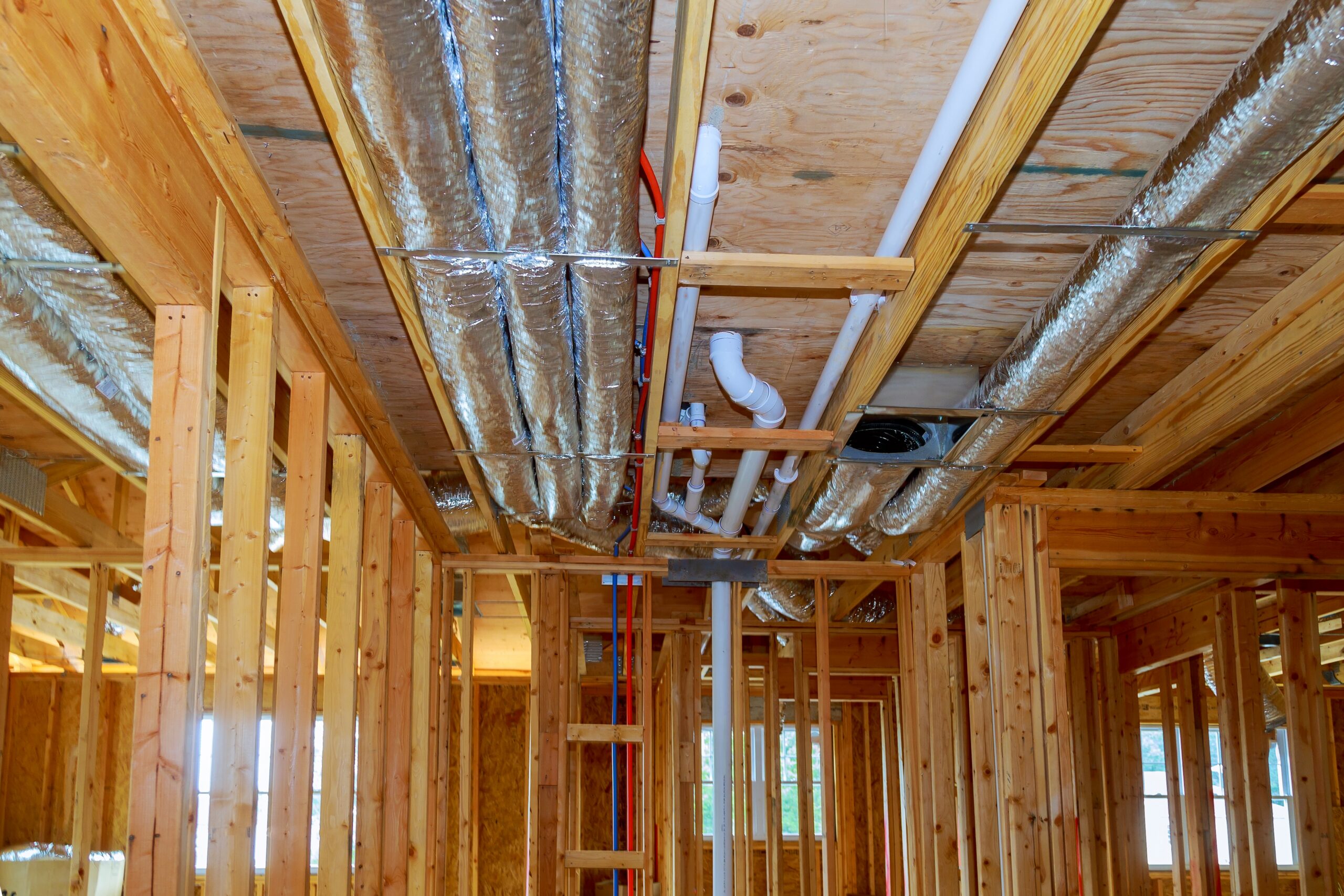 photo of home construction a frame house with of a ventilation system in